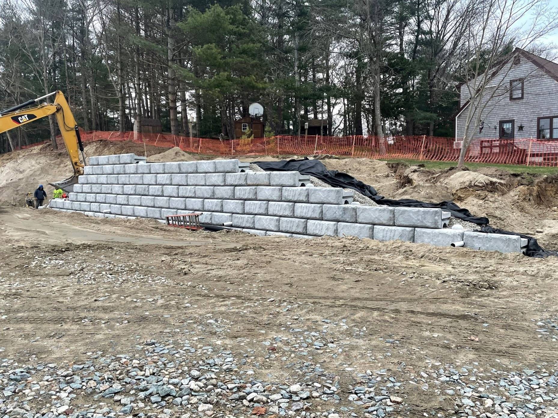 Installation of Retaining Wall, Stone Sub Grade, Fabric, and Blocks - Copy